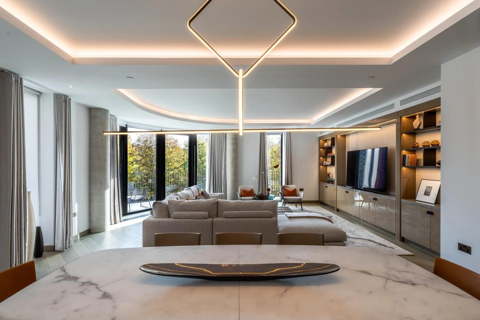 Finished open-plan living space with recessed ceiling lighting